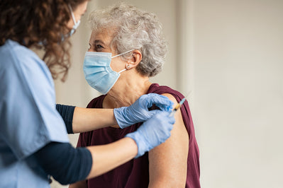 Women getting vaccination