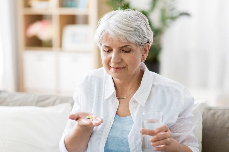 woman taking medications